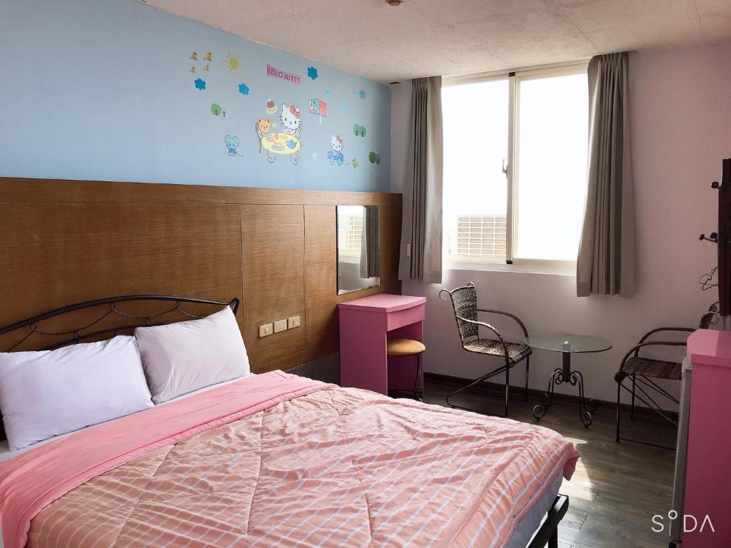 Postel nebo postele na pokoji v ubytování Sheng Feng Homestay