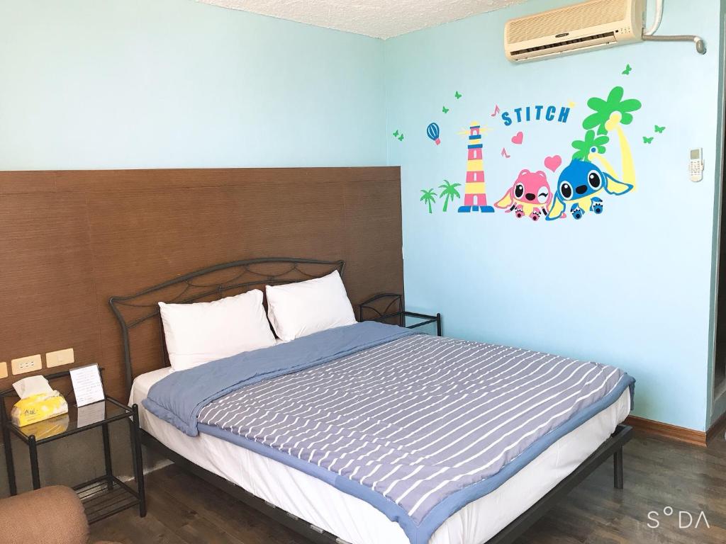 Postel nebo postele na pokoji v ubytování Sheng Feng Homestay