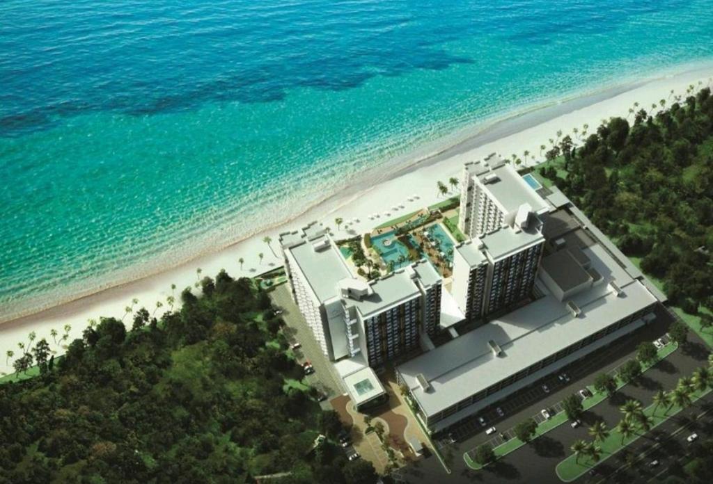 an aerial view of a hotel on the beach at TimurBay Seafront Residence by HardinaHomes in Kuantan