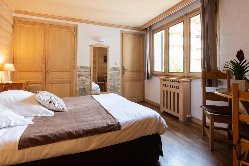 Postel nebo postele na pokoji v ubytování Hôtel La Montagne