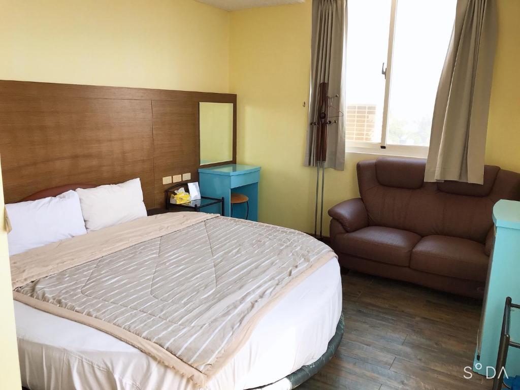 Postel nebo postele na pokoji v ubytování Sheng Feng Homestay