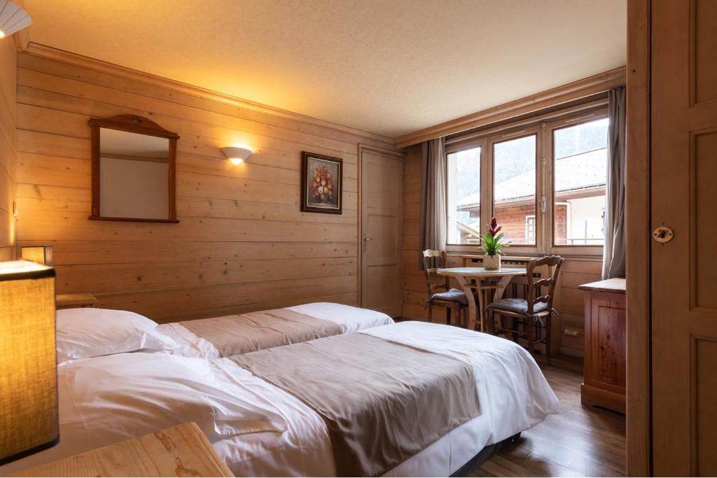 Postel nebo postele na pokoji v ubytování Hôtel La Montagne