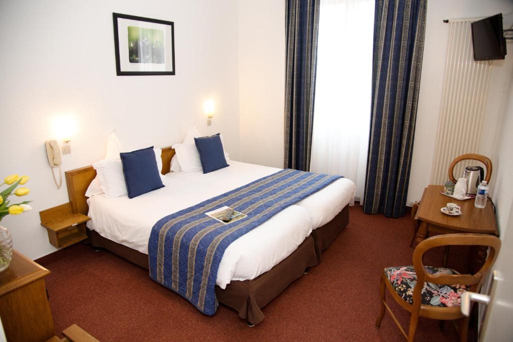 Postel nebo postele na pokoji v ubytování Hôtel Deybach