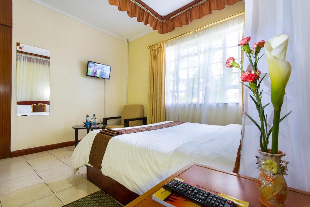 TV a/nebo společenská místnost v ubytování Convent International Hotel- Nairobi