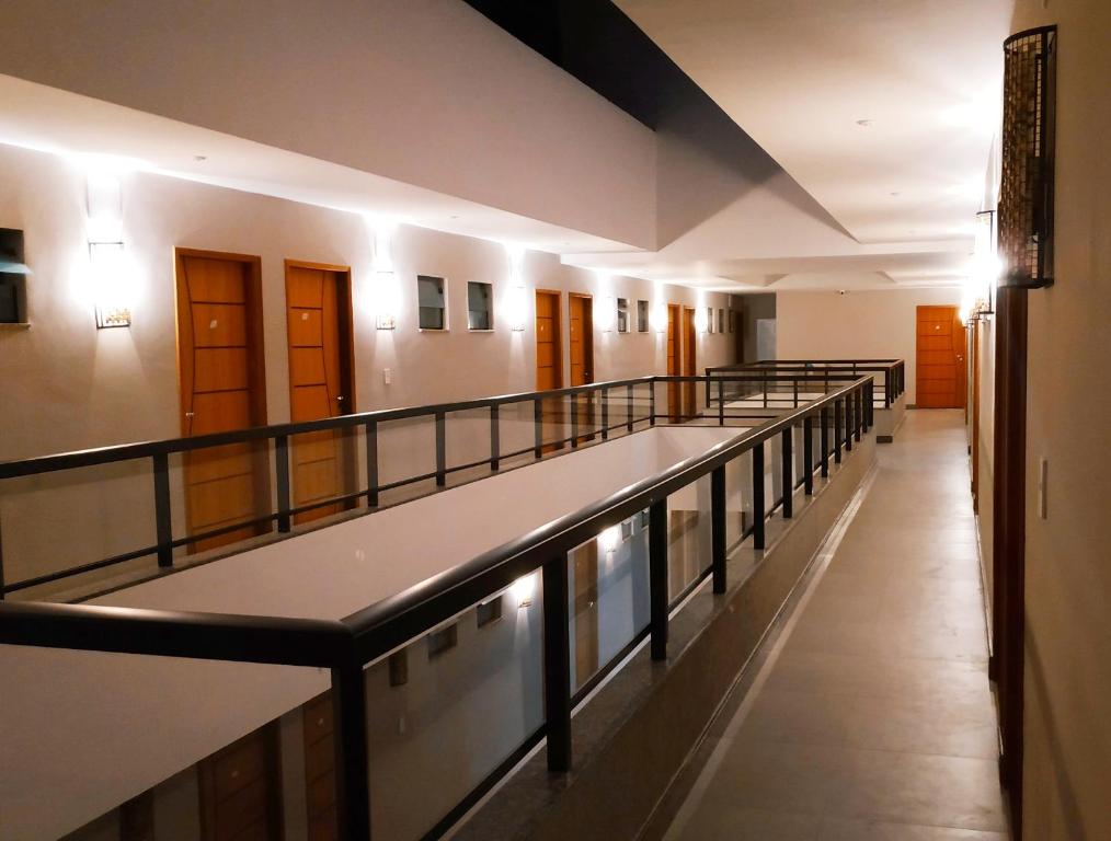 a hallway of a building with a long corridor at Pousada Montanhas do Caparaó in Caparaó Velho