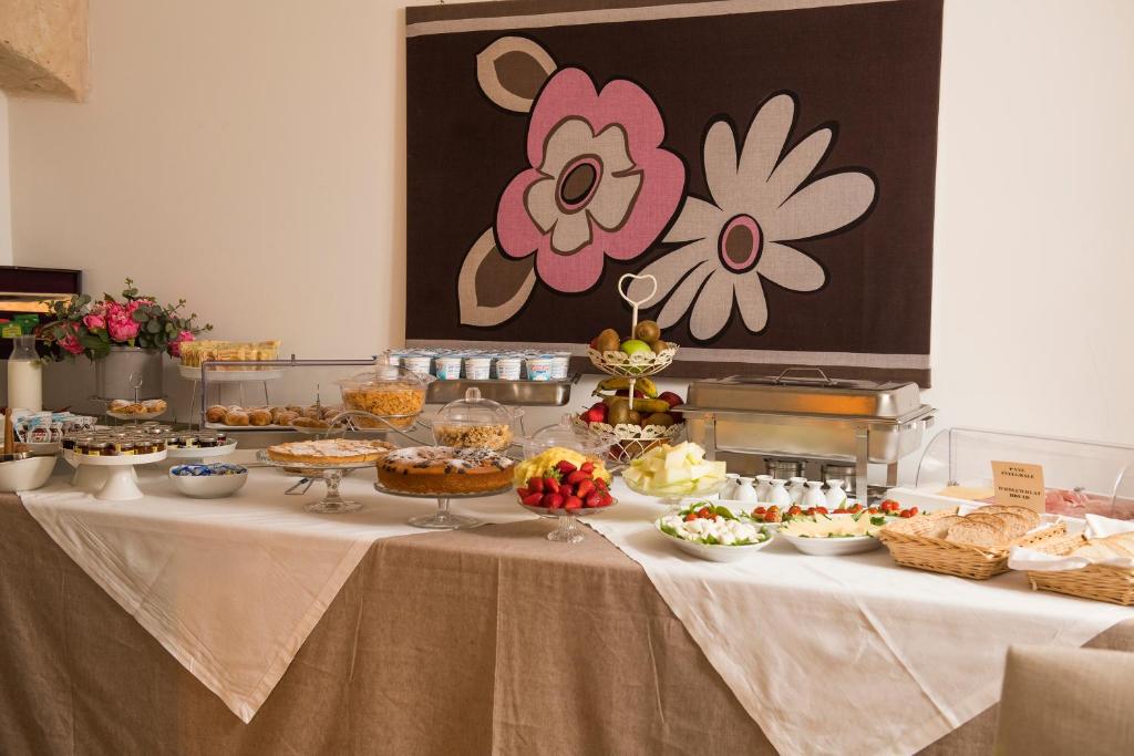 a table with a buffet of food on it at Palazzo Indelli in Monopoli