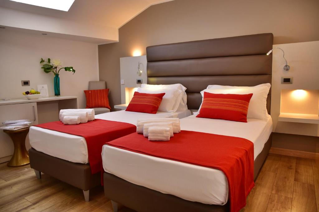 Postel nebo postele na pokoji v ubytování Palazzo Sisto Exclusive Rooms
