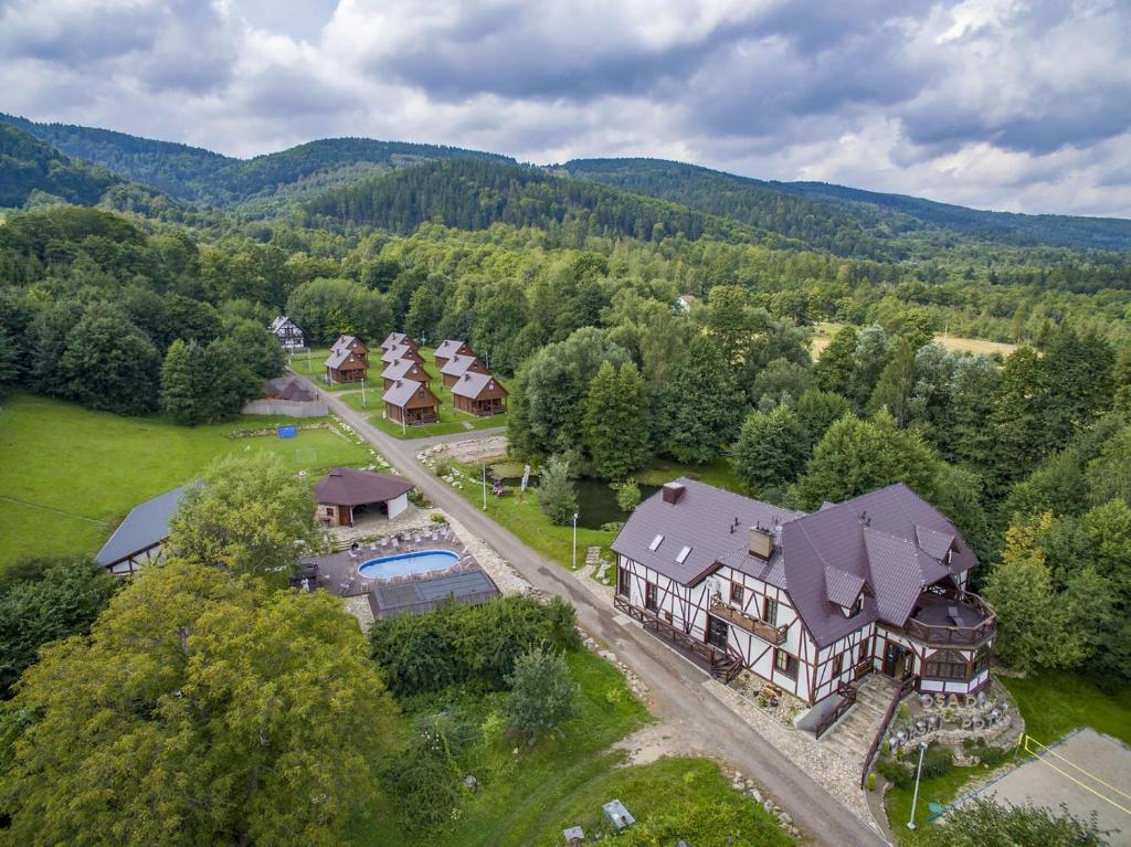 an aerial view of a large house in the mountains at Osada Górski Potok in Szczawina