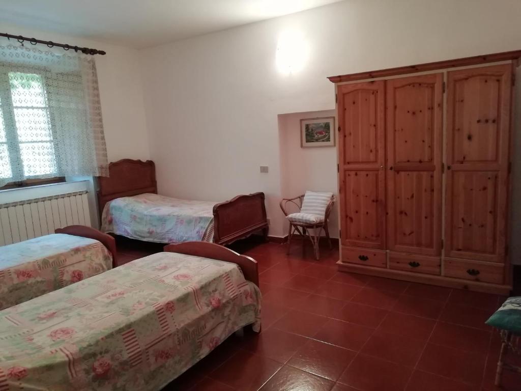 Postel nebo postele na pokoji v ubytování Podere Poggio Corbo