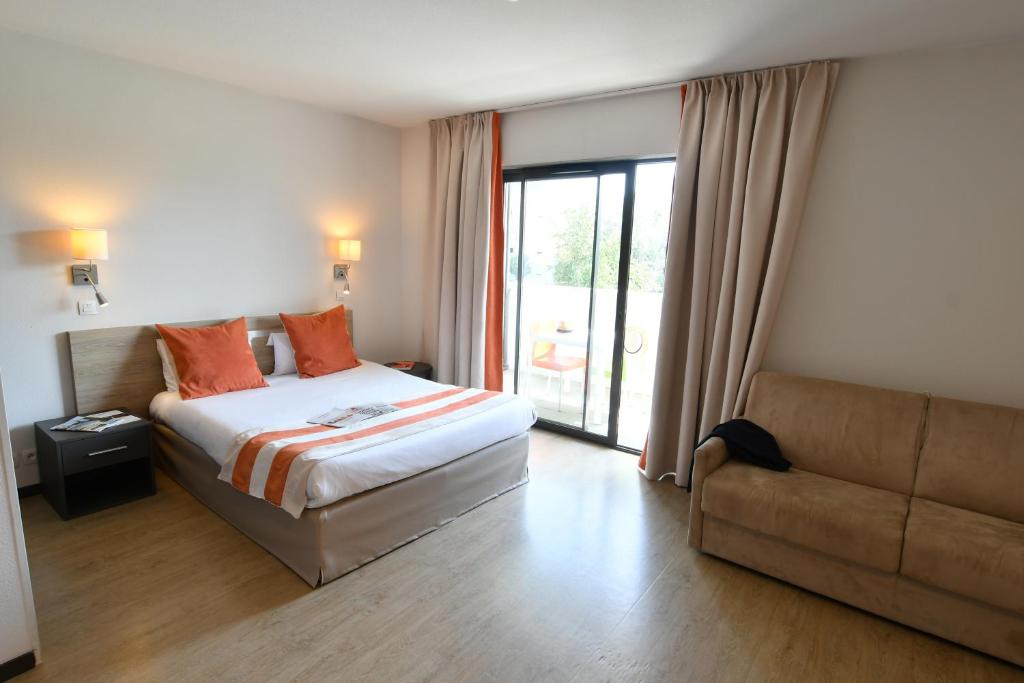 Vuode tai vuoteita majoituspaikassa Appart-Hôtel Mer & Golf City Bordeaux - Bruges