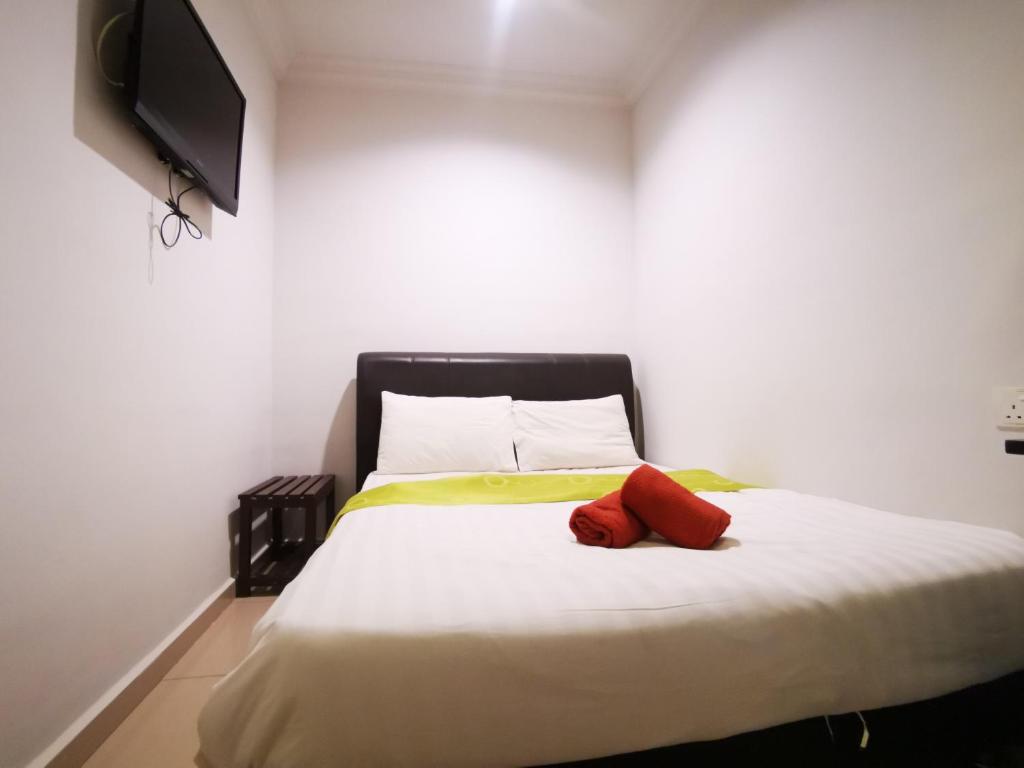 Postel nebo postele na pokoji v ubytování Clover Hotel Port Dickson