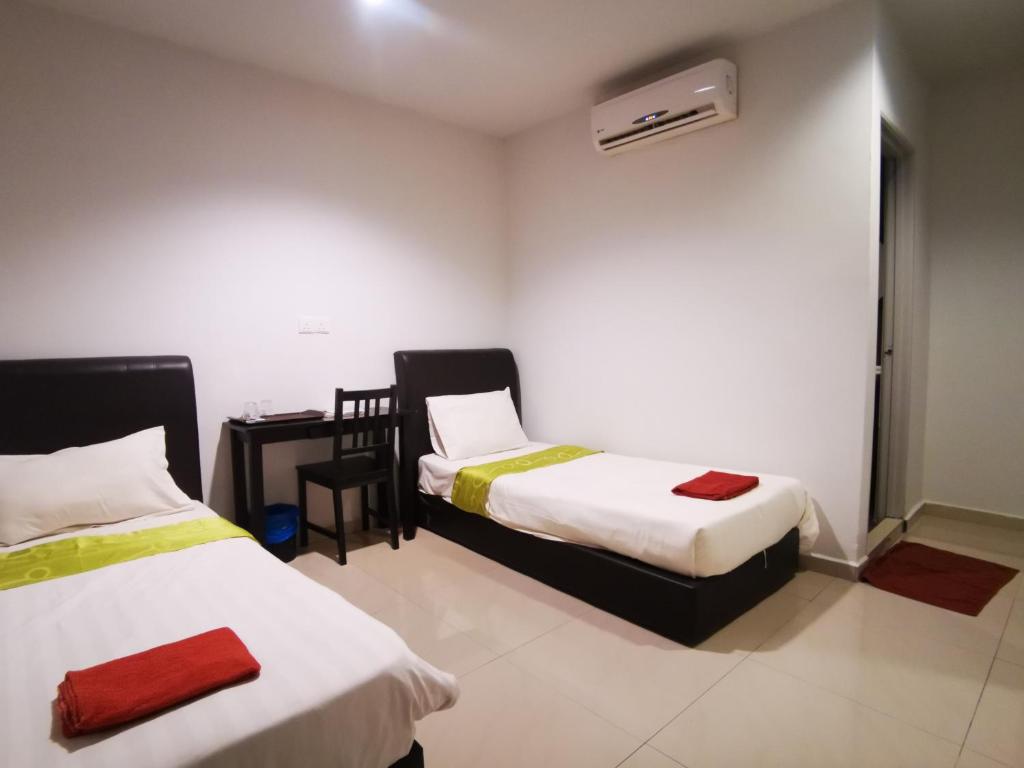Postel nebo postele na pokoji v ubytování Clover Hotel Port Dickson