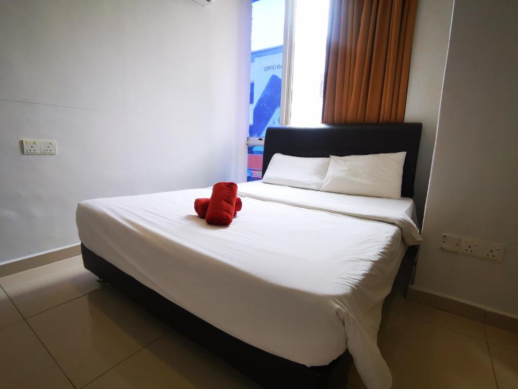 Postel nebo postele na pokoji v ubytování Clover Hotel Port Dickson