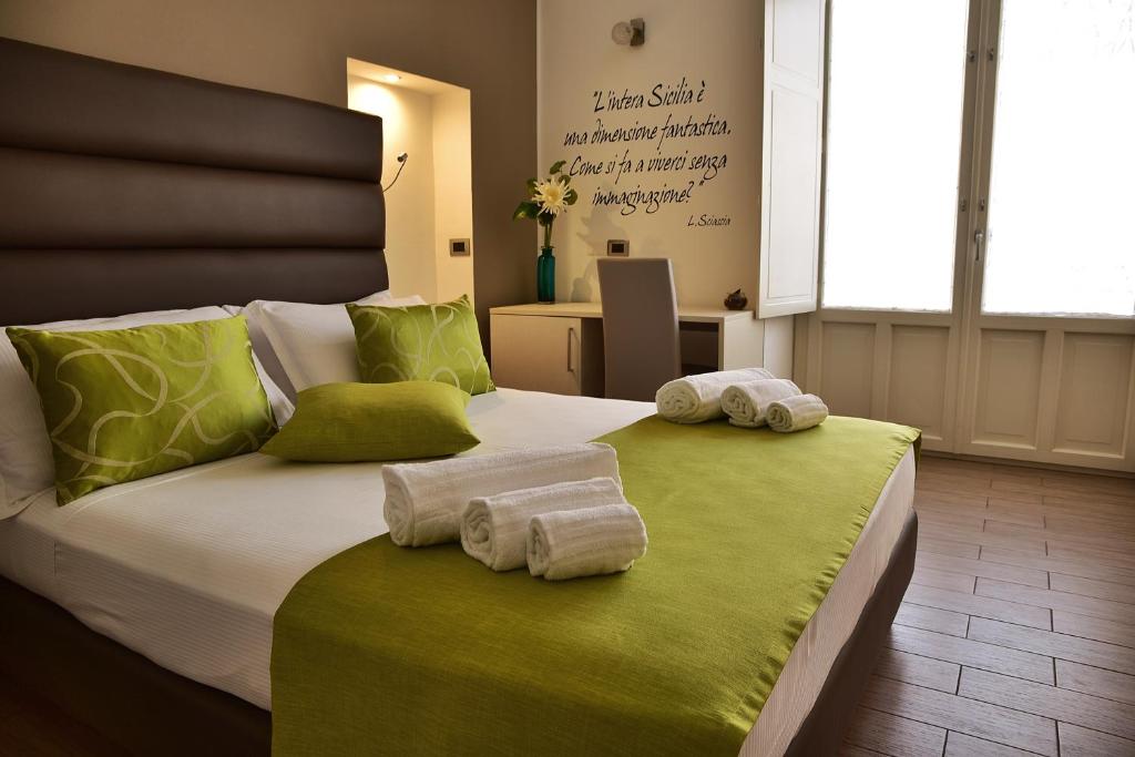 Postel nebo postele na pokoji v ubytování Palazzo Sisto Exclusive Rooms