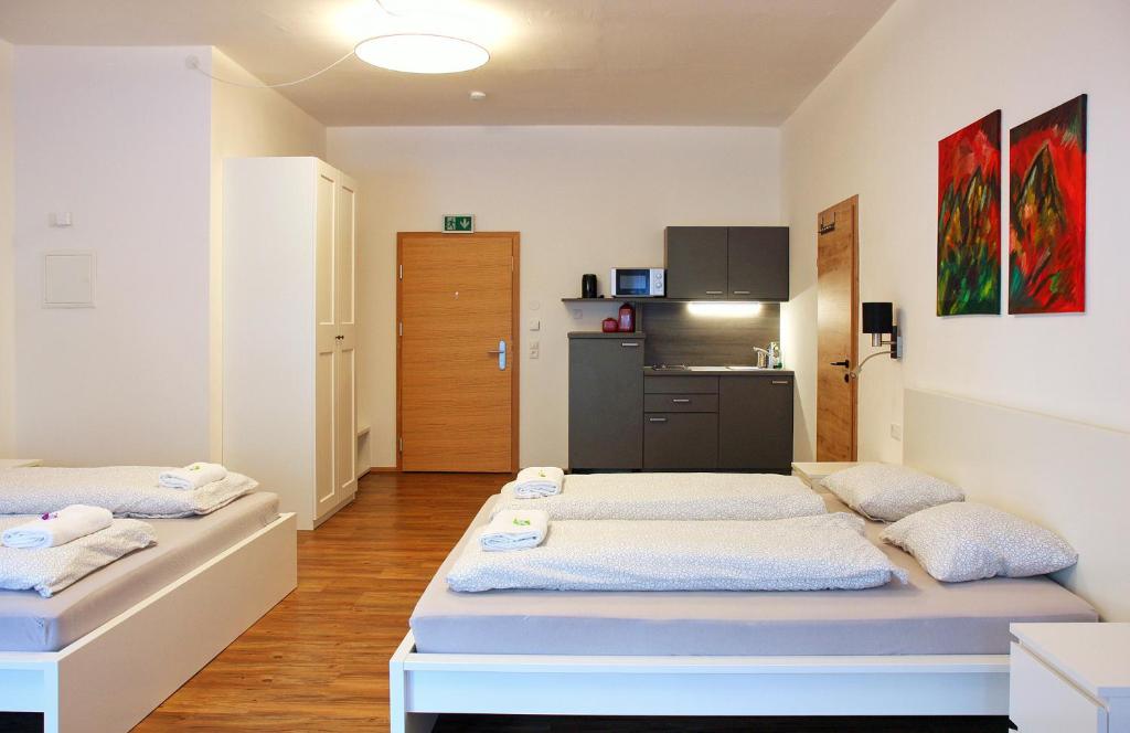 Cama ou camas em um quarto em Nigler Innsbruck Apartment