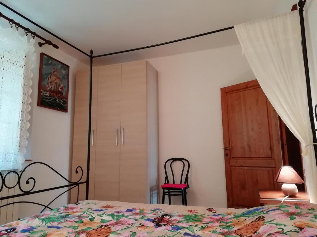 Postel nebo postele na pokoji v ubytování Podere Poggio Corbo