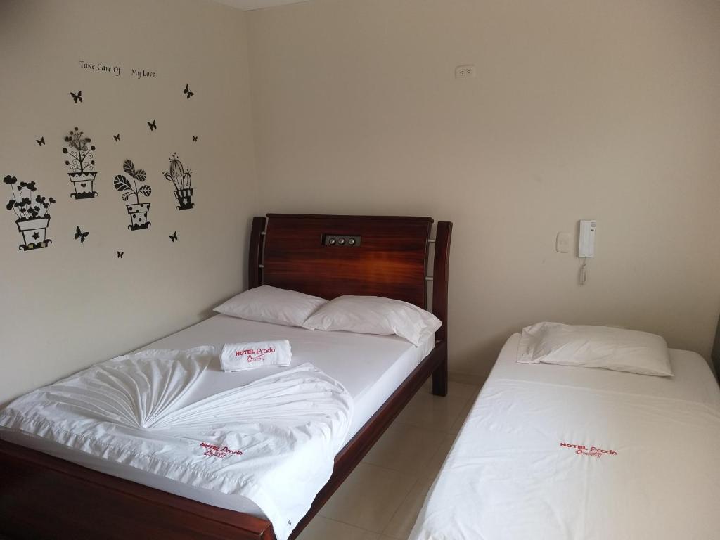 Postel nebo postele na pokoji v ubytování Hotel Prado Country
