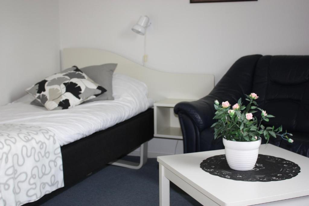 Postel nebo postele na pokoji v ubytování Hotell Angöringen