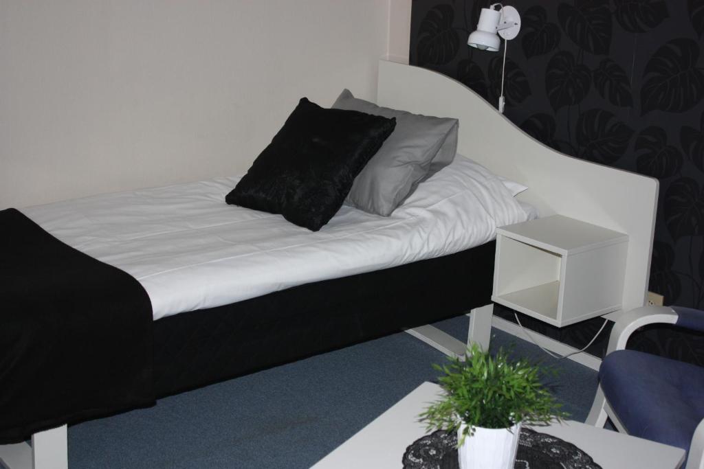 Postel nebo postele na pokoji v ubytování Hotell Angöringen