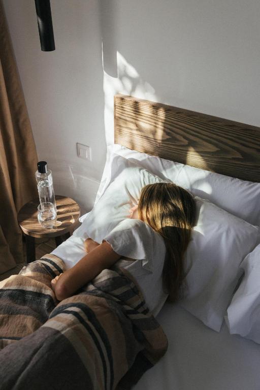 Postel nebo postele na pokoji v ubytování Alava Suites