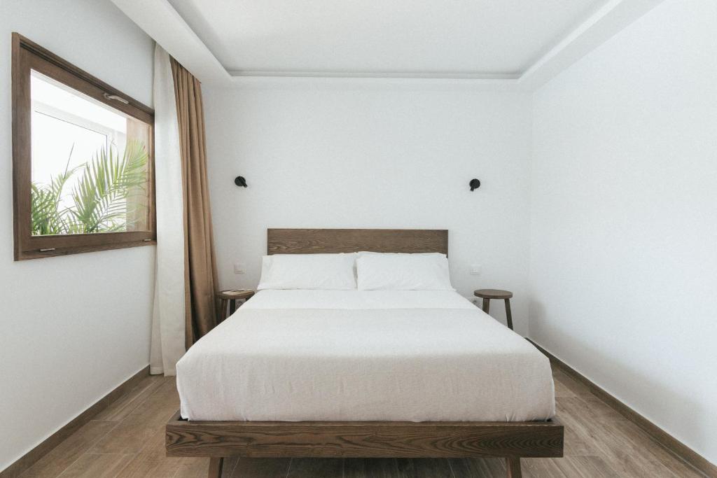 Postel nebo postele na pokoji v ubytování Alava Suites