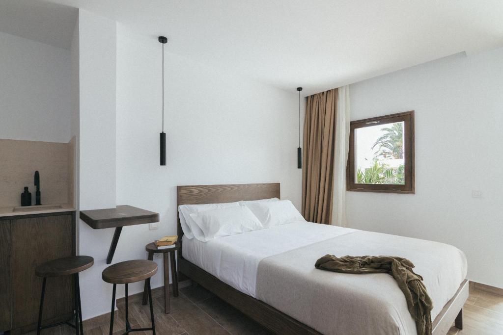 Postel nebo postele na pokoji v ubytování Alava Suites