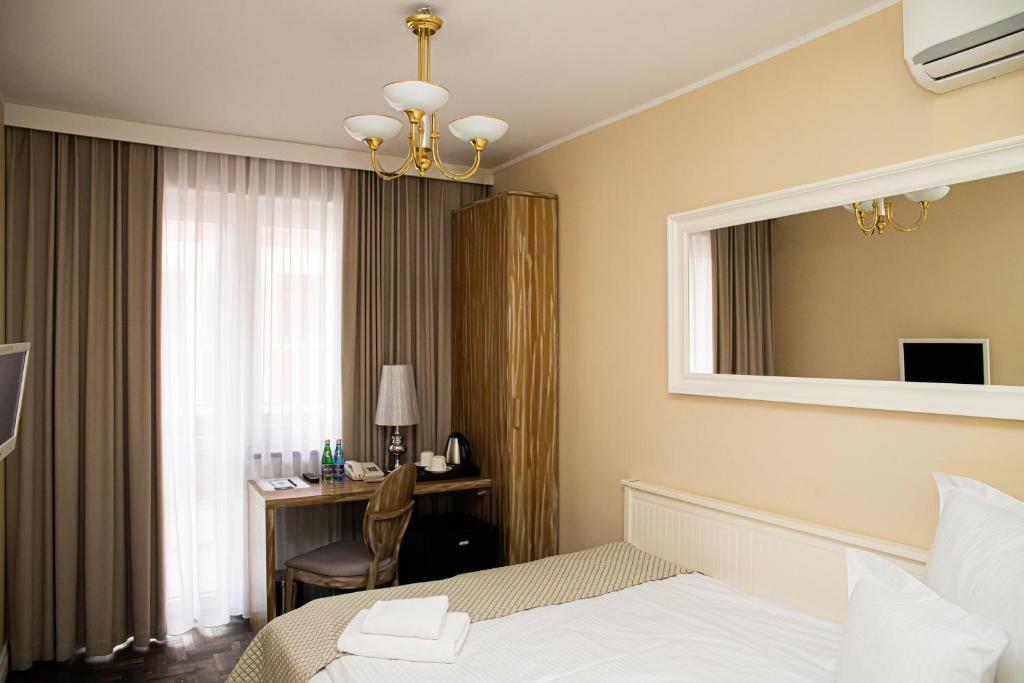 Postel nebo postele na pokoji v ubytování Hotel Wodnik