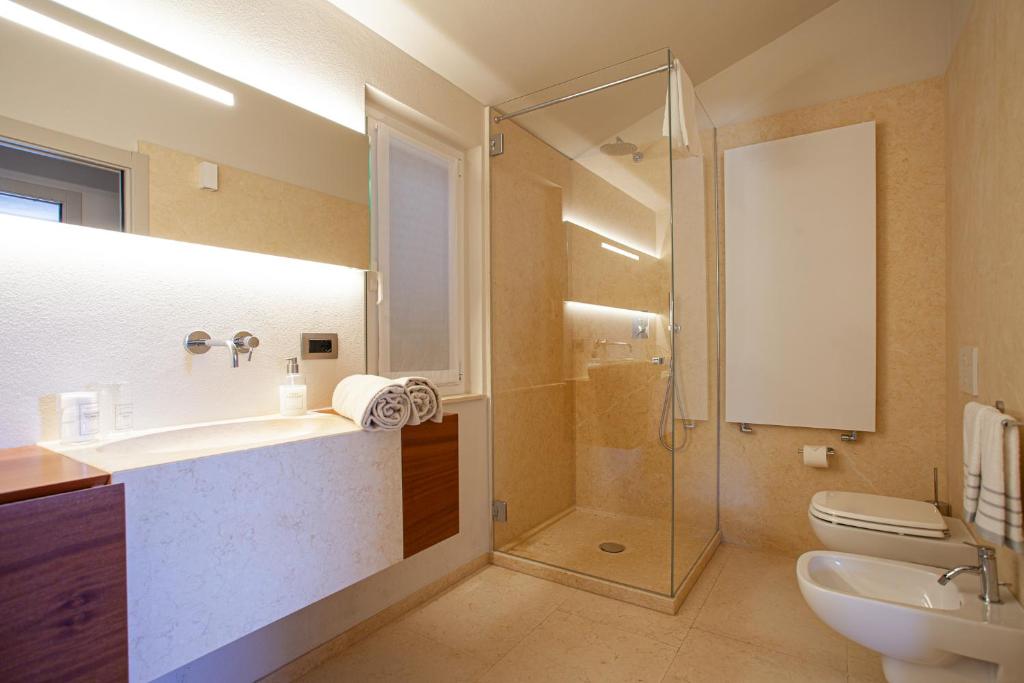 a bathroom with a shower and a sink and a toilet at Il Leccio - Luxury Resort Portofino Monte in Santa Margherita Ligure