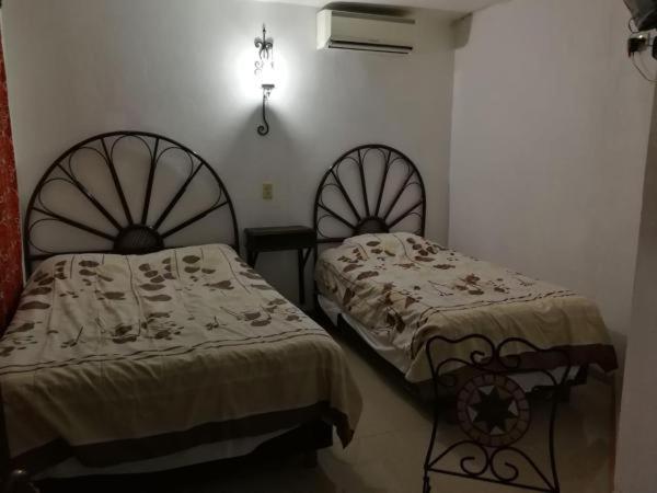 Postel nebo postele na pokoji v ubytování Hotel Posada del Angel