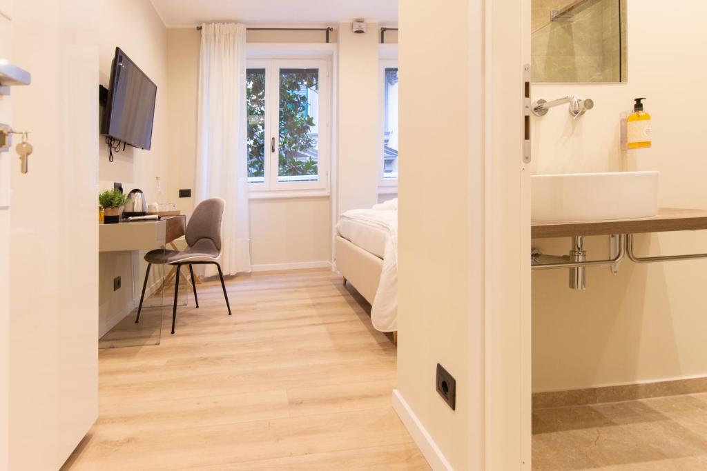A bed or beds in a room at Prati 25.7 Suites in Rome