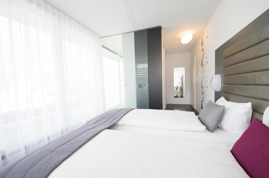 Postel nebo postele na pokoji v ubytování Sky Design Motel
