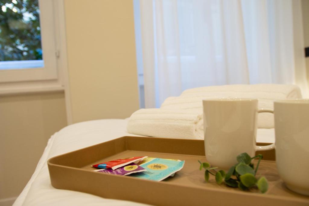 A bed or beds in a room at Prati 25.7 Suites in Rome