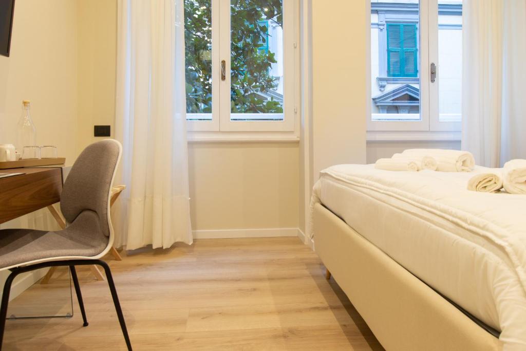 A bed or beds in a room at Prati 25.7 Suites in Rome