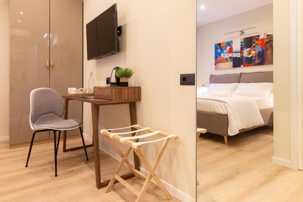 A bed or beds in a room at Prati 25.7 Suites in Rome