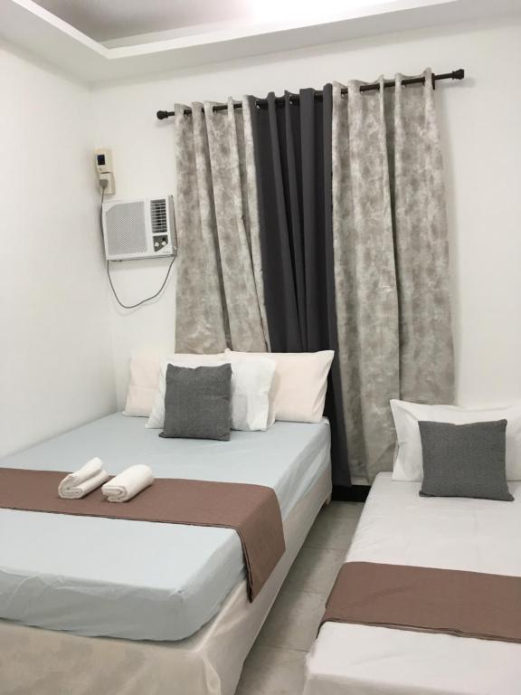 Postel nebo postele na pokoji v ubytování Bolinao Transient House B