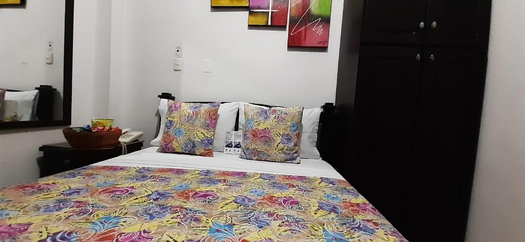 Postel nebo postele na pokoji v ubytování Hotel Colonial