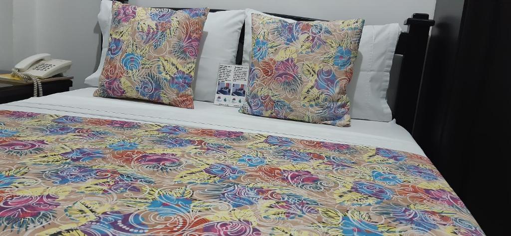 Postel nebo postele na pokoji v ubytování Hotel Colonial