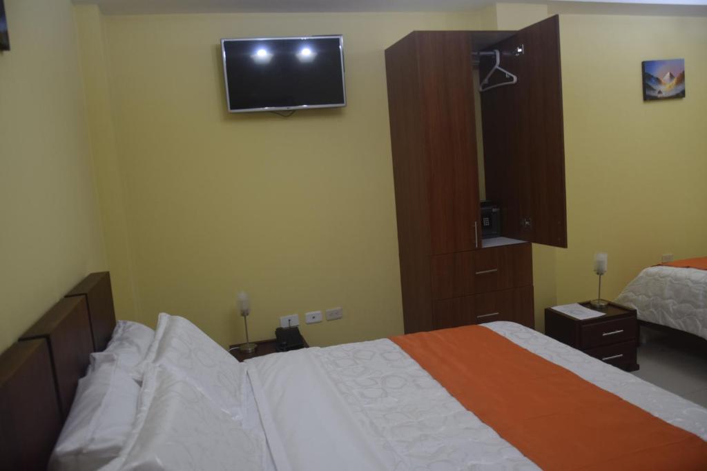 Postel nebo postele na pokoji v ubytování Olan´s Hotel Group