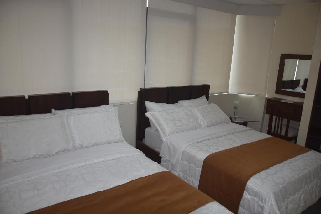 Postel nebo postele na pokoji v ubytování Olan´s Hotel Group