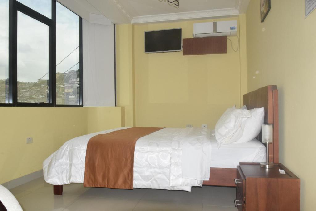 Postel nebo postele na pokoji v ubytování Olan´s Hotel Group