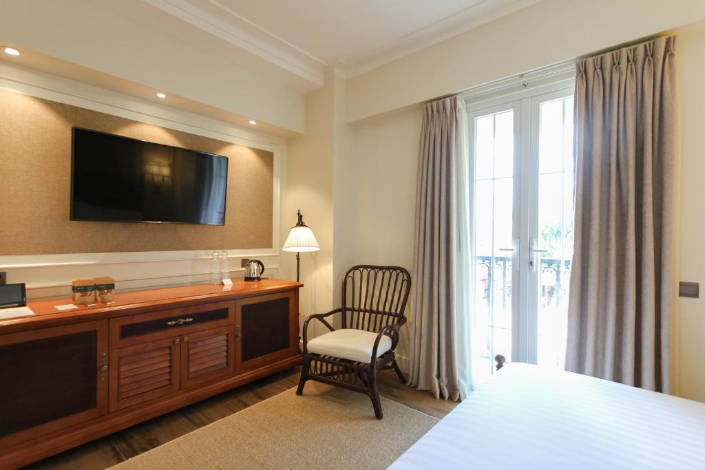 Uma televisão e/ou sistema de entretenimento em Feliz Hotel Boracay