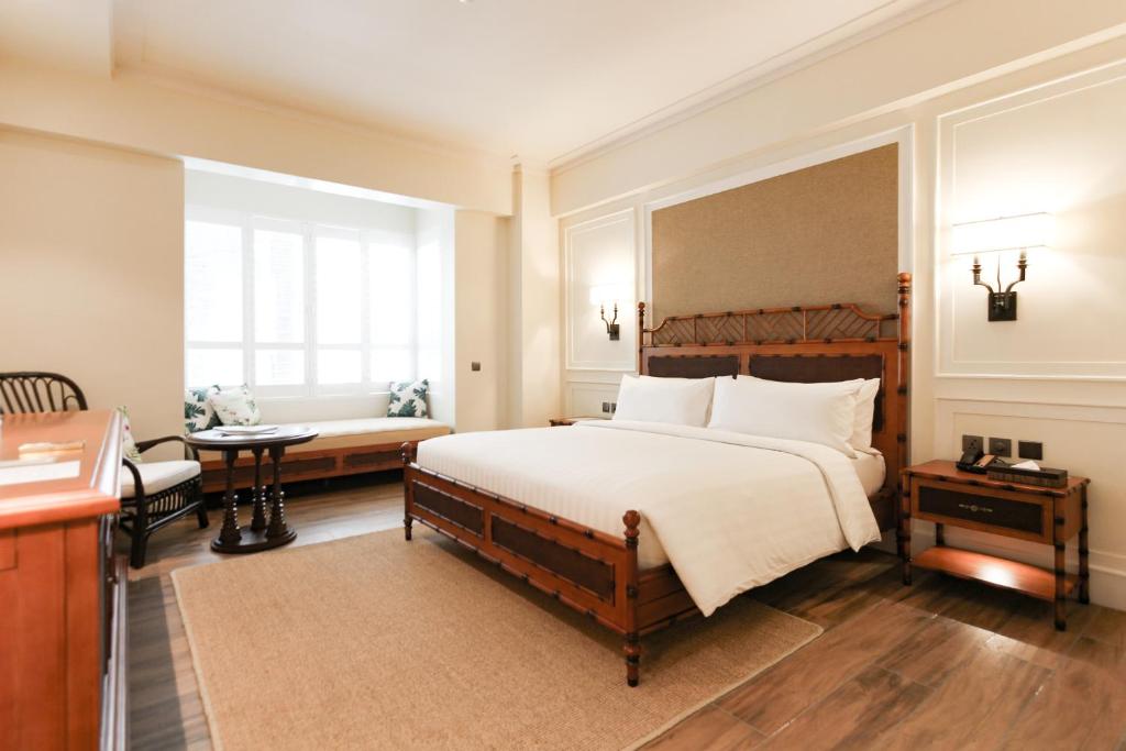 Uma cama ou camas num quarto em Feliz Hotel Boracay