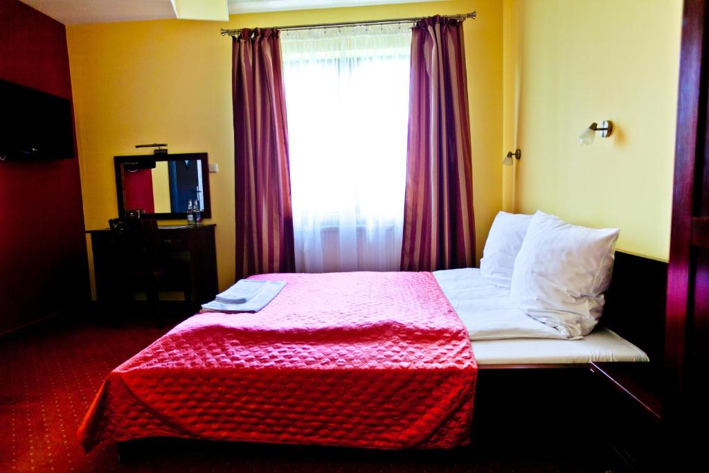 Postel nebo postele na pokoji v ubytování Dwa Bratanki