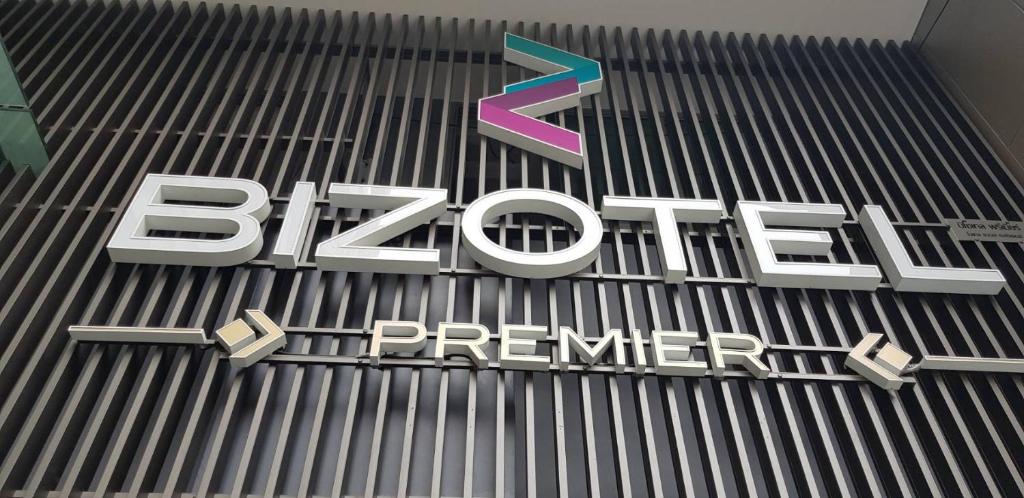 a sign on the side of a building at Bizotel Premier Hotel & Residence in Bangkok