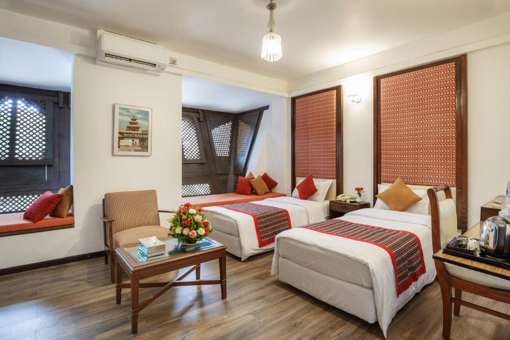 Postel nebo postele na pokoji v ubytování Hotel Manaslu