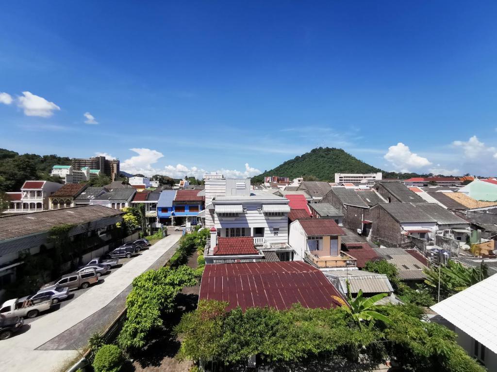an aerial view of a town with houses at The Besavana Phuket - SHA Extra Plus in Phuket Town