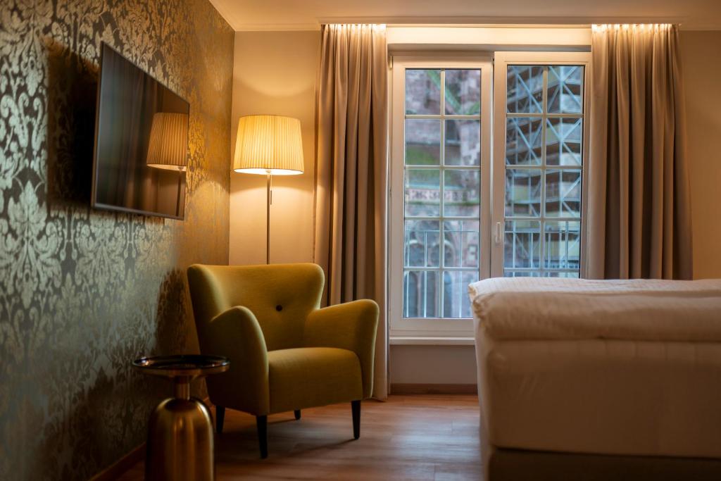 TV a/nebo společenská místnost v ubytování Hotel Rappen am Münsterplatz