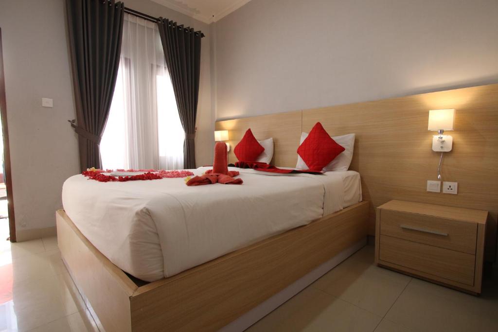 Postel nebo postele na pokoji v ubytování Tom Guest House