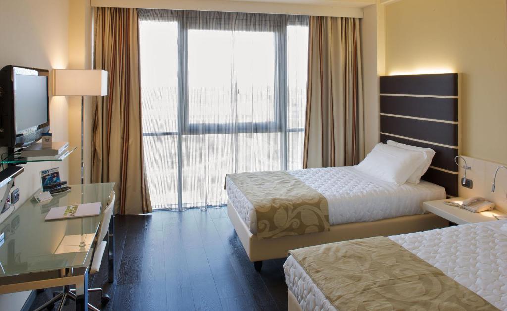 Posteľ alebo postele v izbe v ubytovaní Grand Hotel Mattei