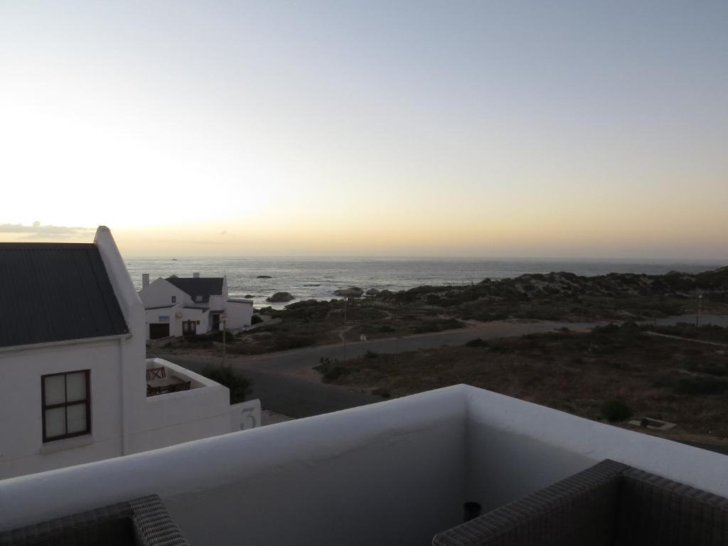 a view of the ocean from the balcony of a house at Oppidraai B in Paternoster